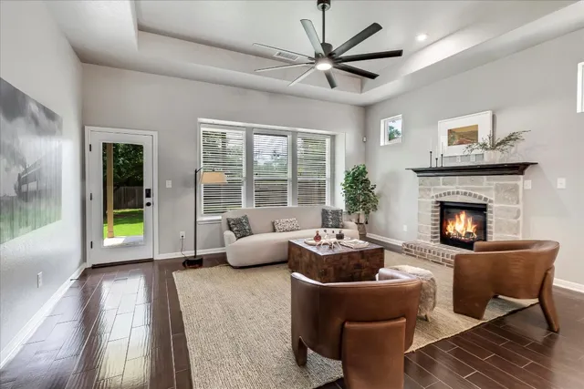 a living room with furniture and a fireplace