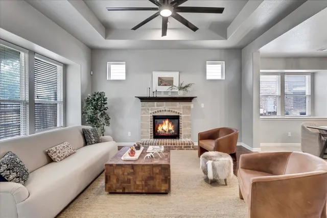 a living room with furniture and a fireplace