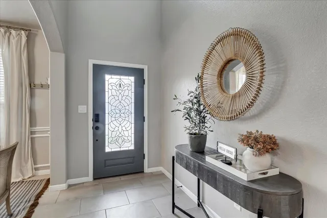 a view of a dining room with furniture and window