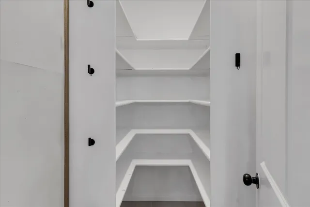 a view of staircase with white walls