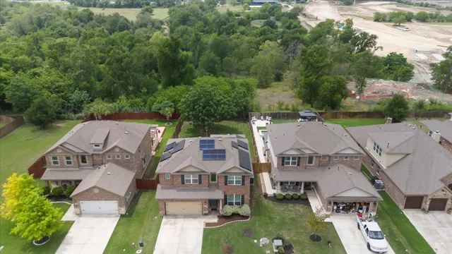 an aerial view of a house with a garden