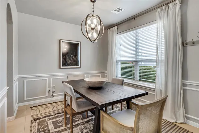 a kitchen with a table and chairs