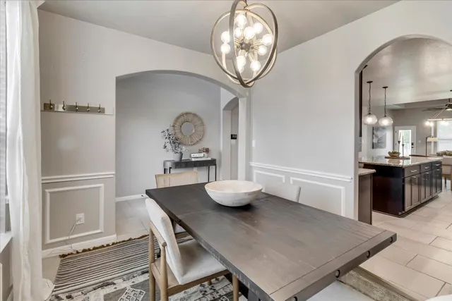 a kitchen with granite countertop a sink a counter top space appliances and cabinets