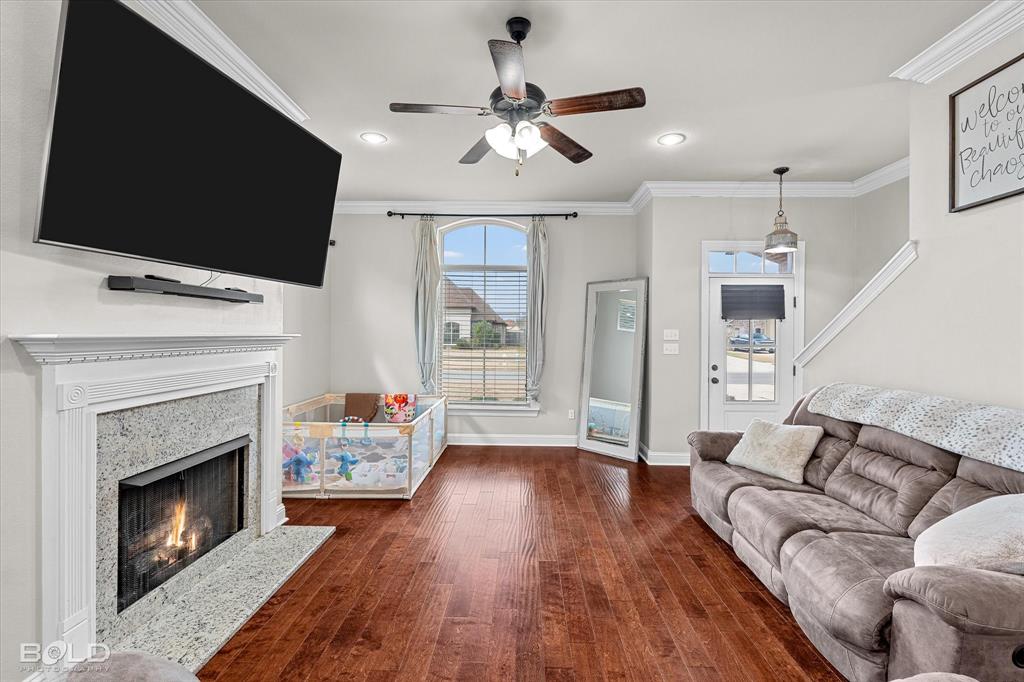 946 Maize Street Bossier City, LA 71111 - Photo 15 of 39 a living room with furniture fireplace and flat screen tv