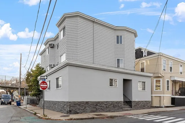 a street sign on a pole on a street