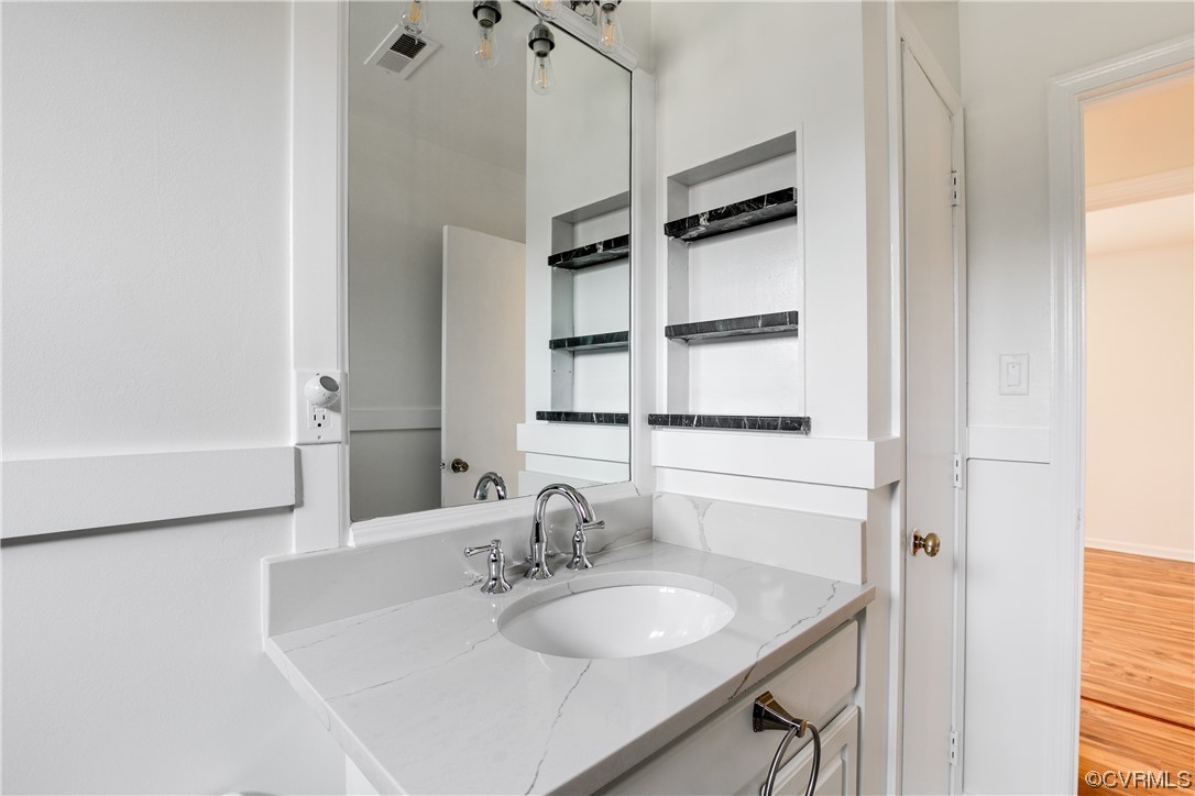 8675 Beatties Mill Road Mechanicsville, VA 23111 - Photo 18 of 25 a bathroom with a granite countertop sink and a mirror