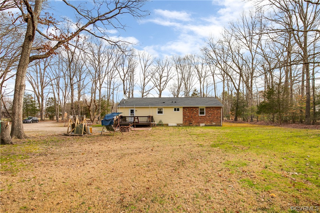 8675 Beatties Mill Road Mechanicsville, VA 23111 - Photo 22 of 25 a view of a house with a large tree in front of it