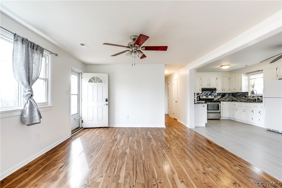 8675 Beatties Mill Road Mechanicsville, VA 23111 - Photo 5 of 25 a view of a kitchen with wooden floor and a kitchen