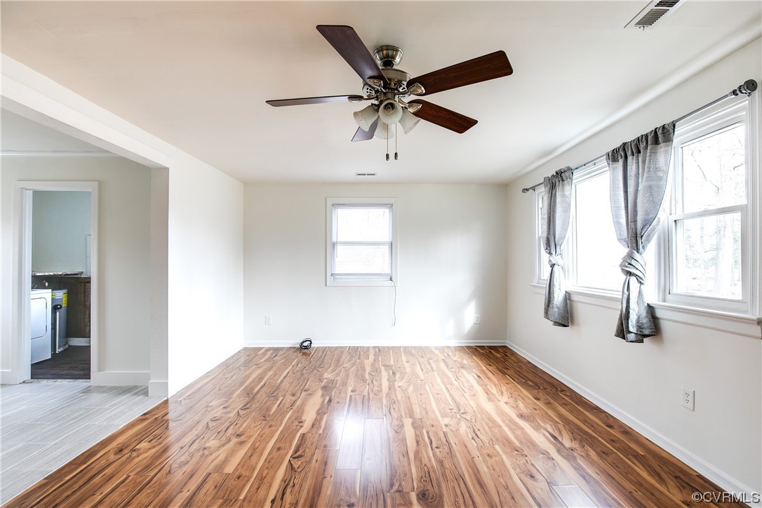 8675 Beatties Mill Road Mechanicsville, VA 23111 - Photo 6 of 25 wooden floor in an empty room with a window