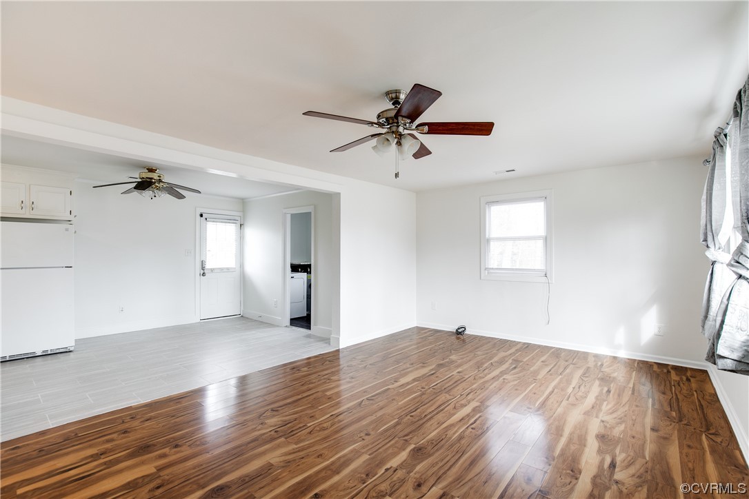 8675 Beatties Mill Road Mechanicsville, VA 23111 - Photo 7 of 25 a view of a big room with wooden floor and windows
