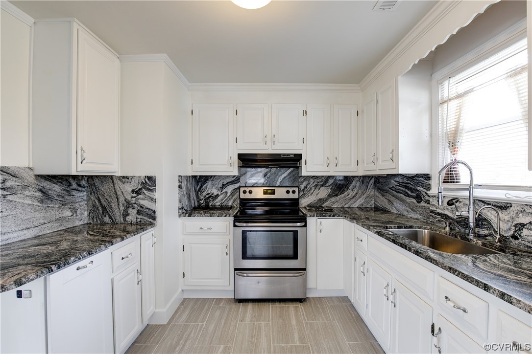 8675 Beatties Mill Road Mechanicsville, VA 23111 - Photo 9 of 25 a kitchen with granite countertop white cabinets and stainless steel appliances
