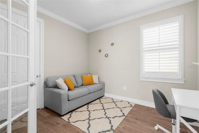 a living room with furniture and a window