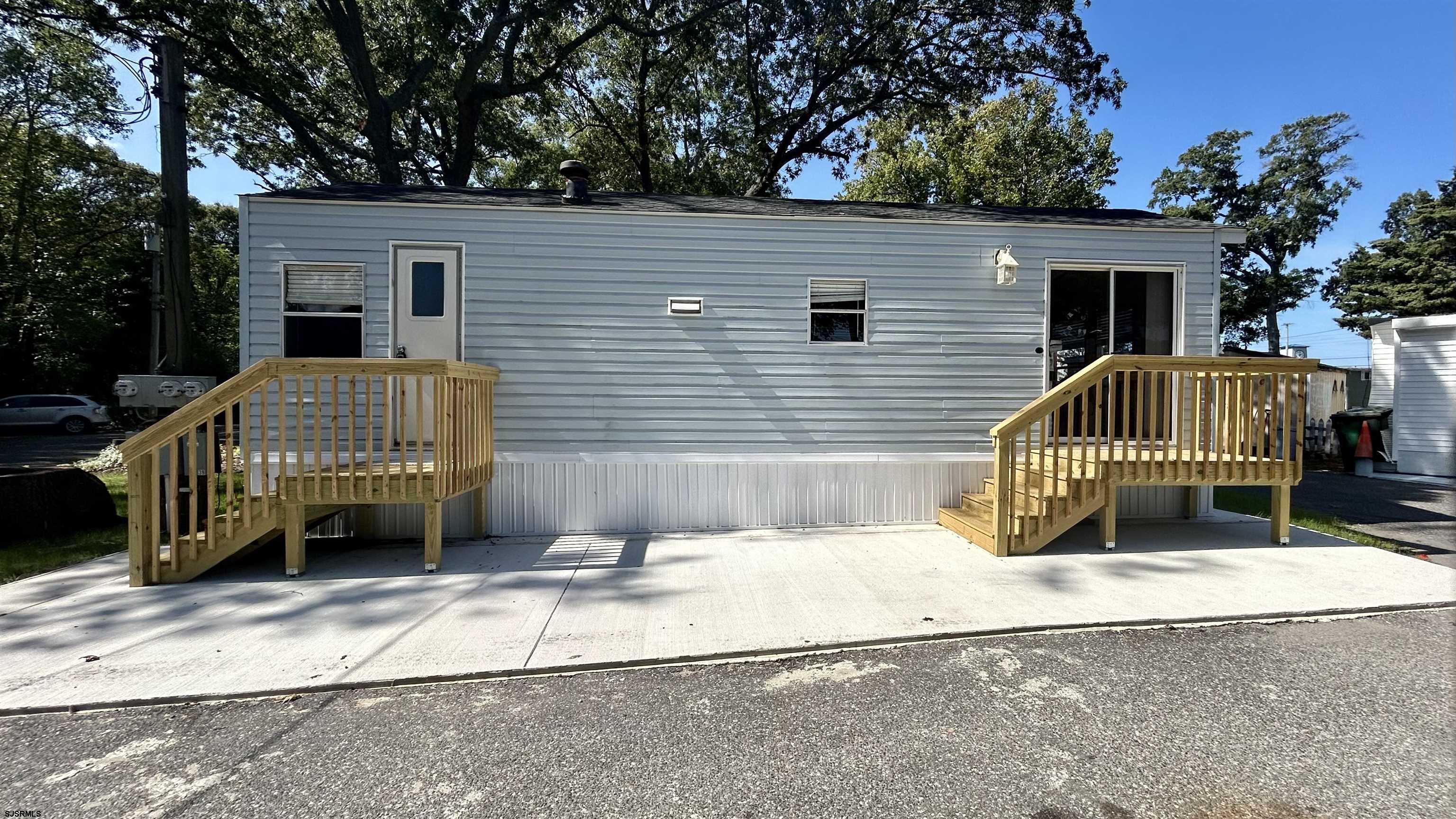 104 South 5th Avenue Rio Grande, NJ 08242 - Photo 20 of 20 a view of backyard with a small cabin and wooden chair