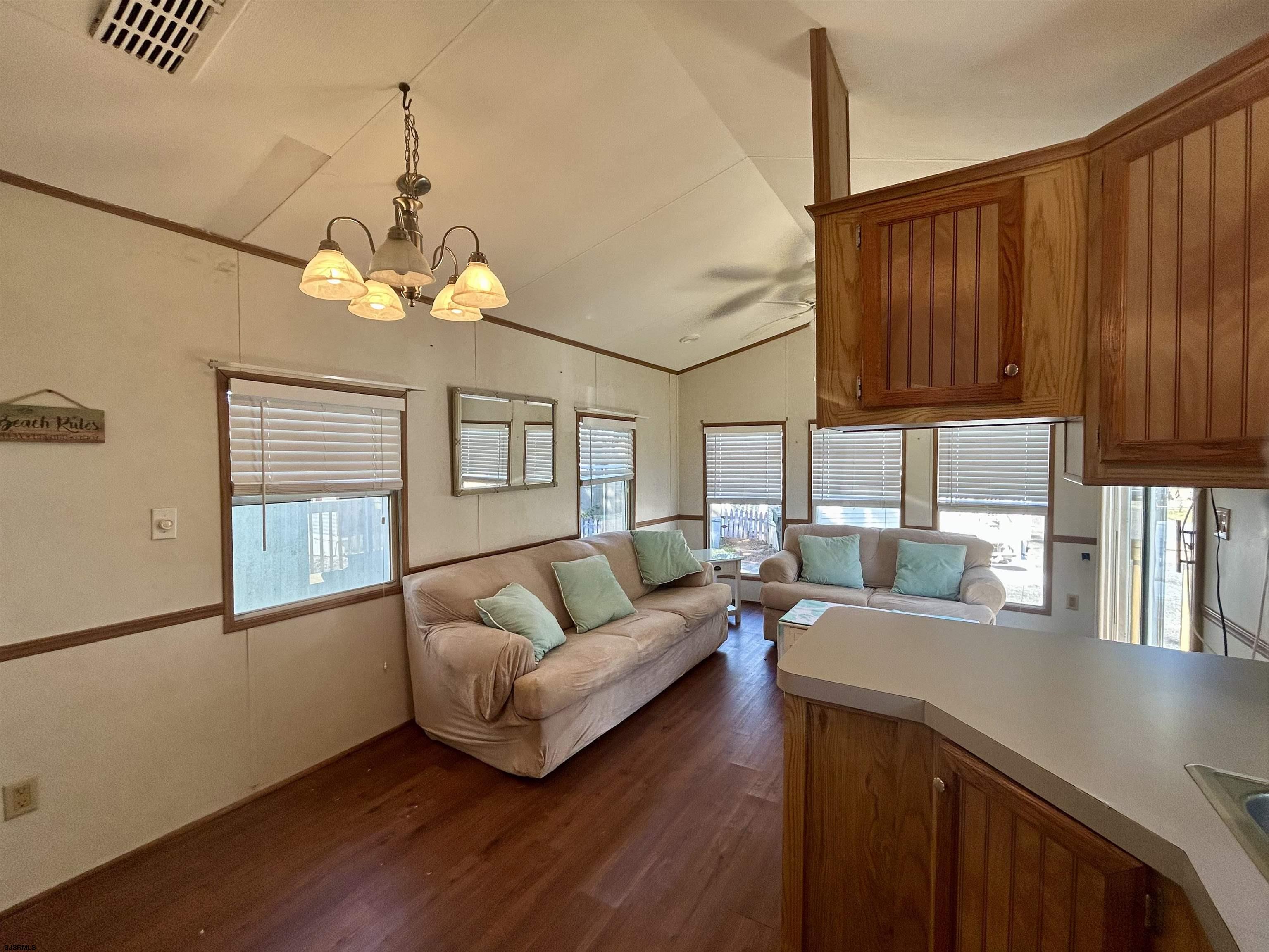104 South 5th Avenue Rio Grande, NJ 08242 - Photo 10 of 20 a living room with furniture and a chandelier