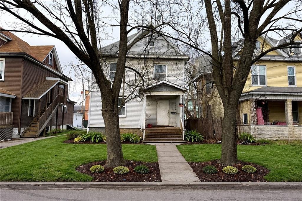 326 West Cunningham Street Butler, PA 16001 - Photo 1 of 5 a front view of a house with garden