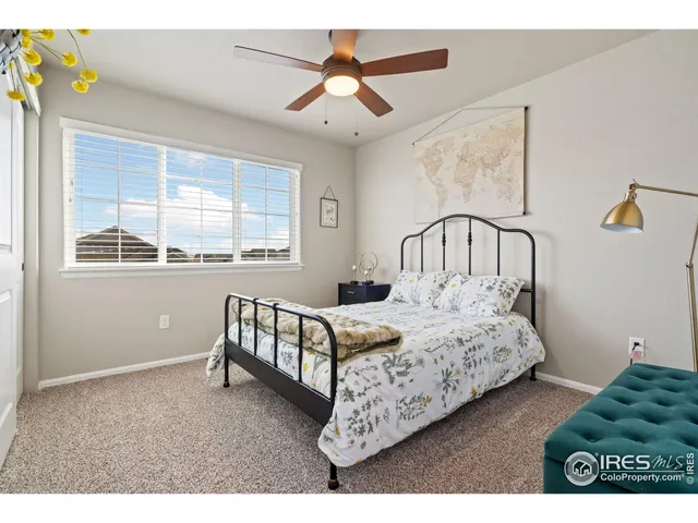 a bedroom with bed and a window