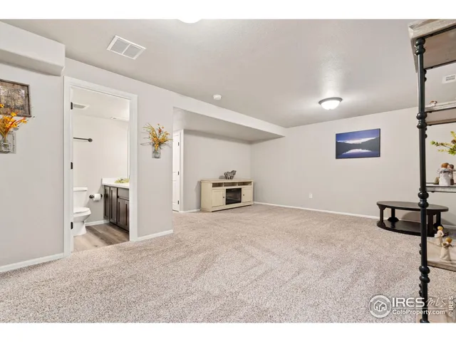 a view of a livingroom with furniture and front door