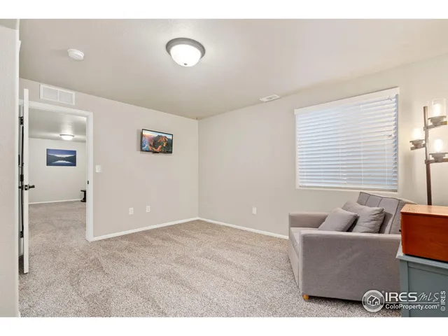 a living room with furniture and window