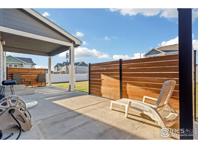 a view of a livingroom with furniture and windows