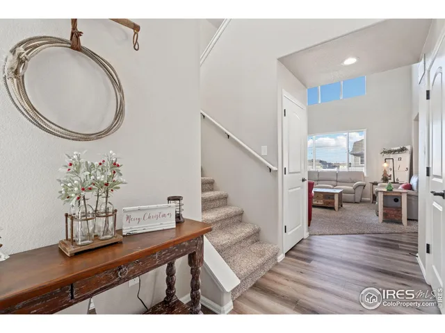 a living room with furniture and a mirror