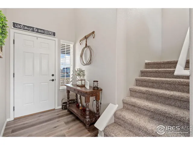 a view of entryway with wooden floor