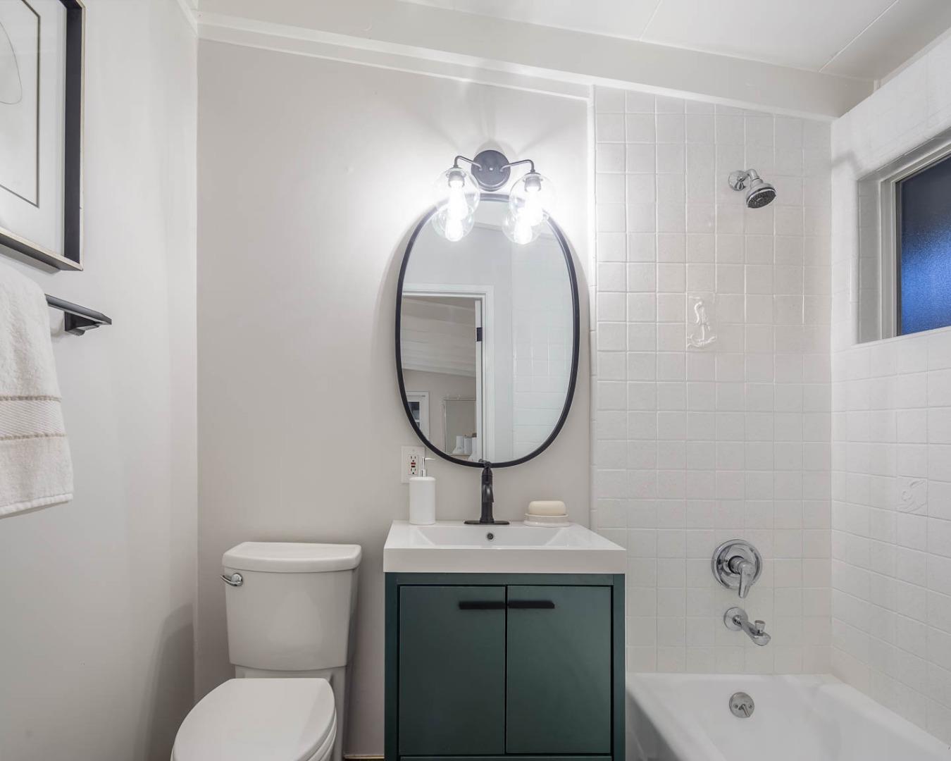2436 Laura Lane Mountain View, CA 94043 - Photo 14 of 19 a bathroom with a sink mirror and toilet