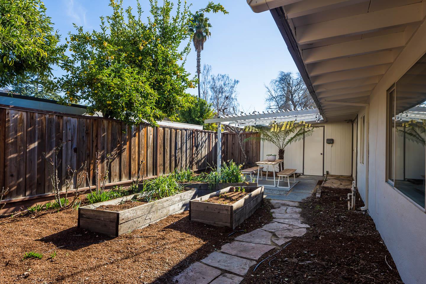 2436 Laura Lane Mountain View, CA 94043 - Photo 15 of 19 a backyard of a house with yard barbeque oven and outdoor seating