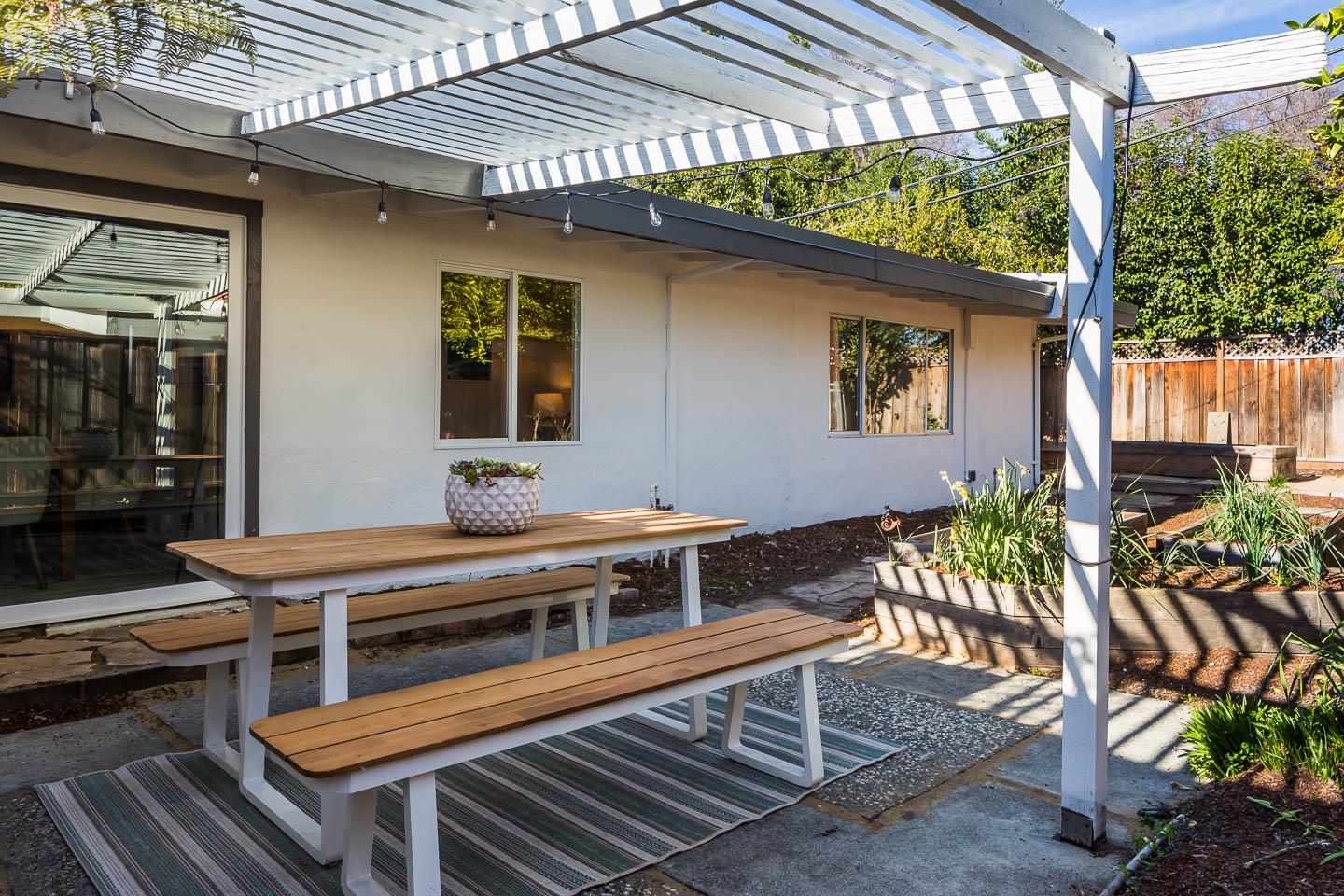 2436 Laura Lane Mountain View, CA 94043 - Photo 16 of 19 a outdoor living area with furniture a table and a potted plant