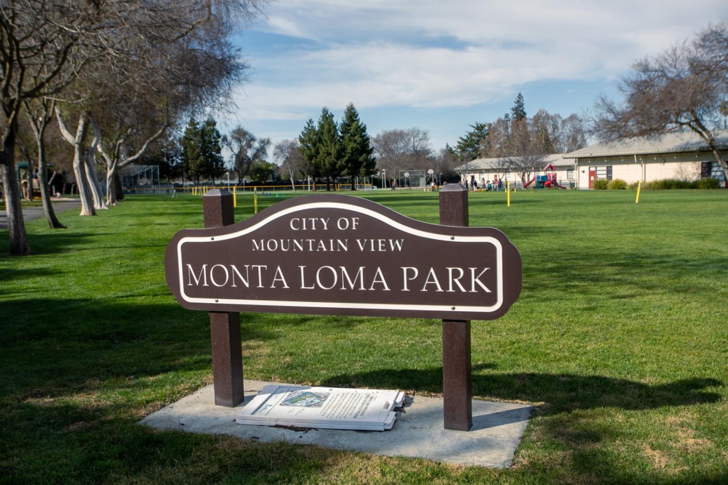 2436 Laura Lane Mountain View, CA 94043 - Photo 18 of 19 a sign that is sitting on a lush green field