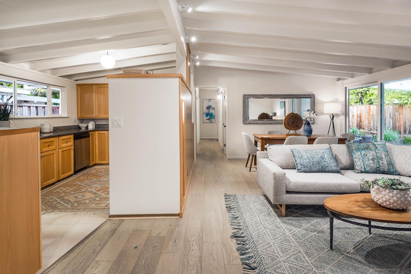 2436 Laura Lane Mountain View, CA 94043 - Photo 2 of 19 a living room with furniture and a kitchen view