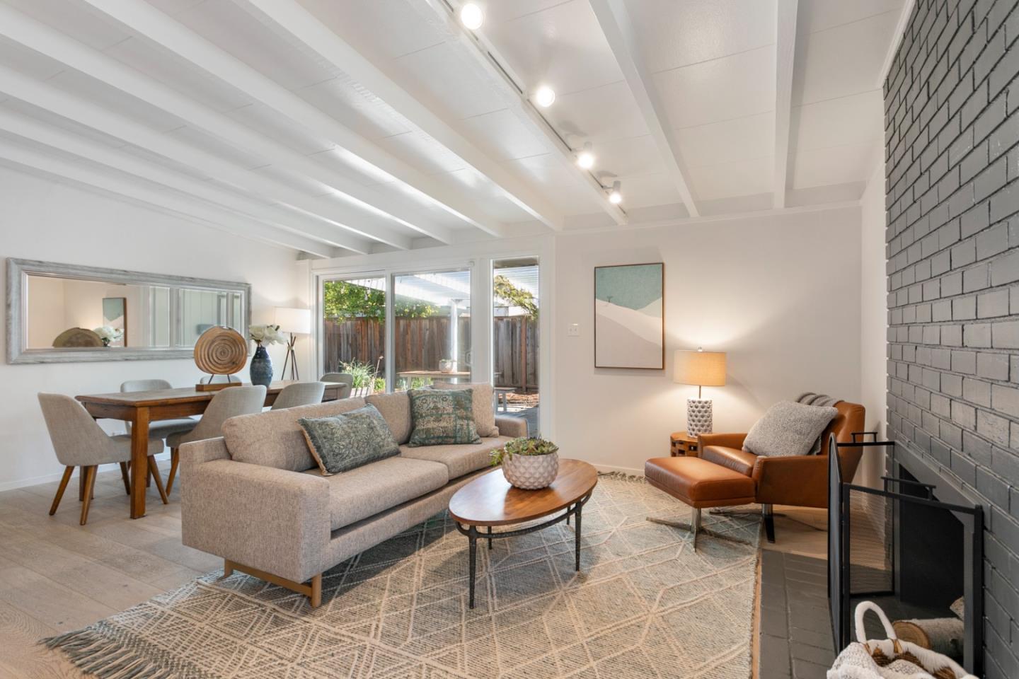 2436 Laura Lane Mountain View, CA 94043 - Photo 3 of 19 a living room with furniture a lamp a rug and a large window