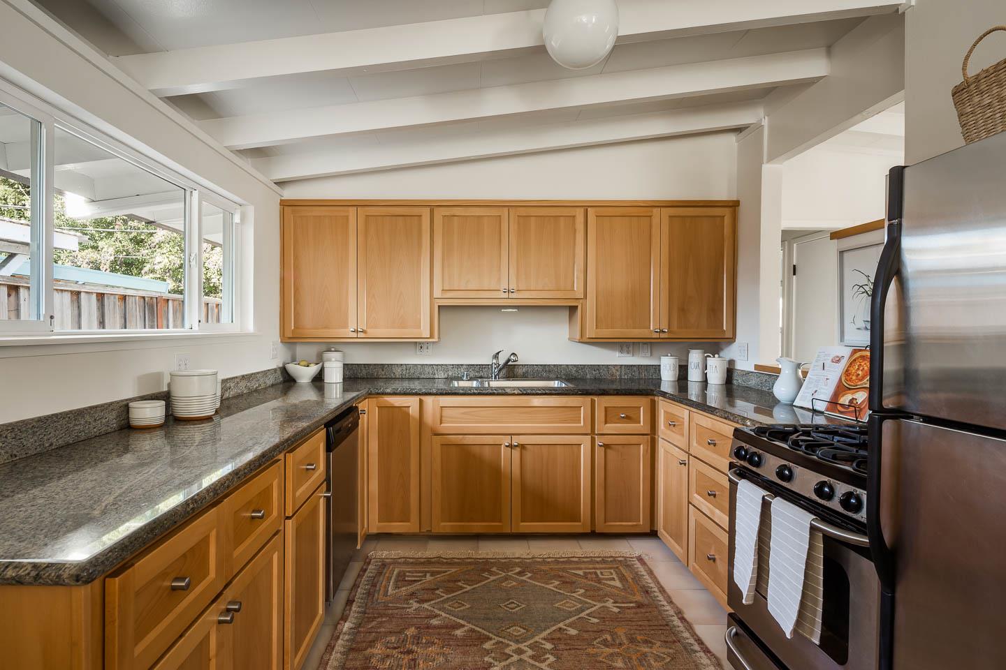 2436 Laura Lane Mountain View, CA 94043 - Photo 4 of 19 a kitchen with stainless steel appliances granite countertop a sink stove and refrigerator
