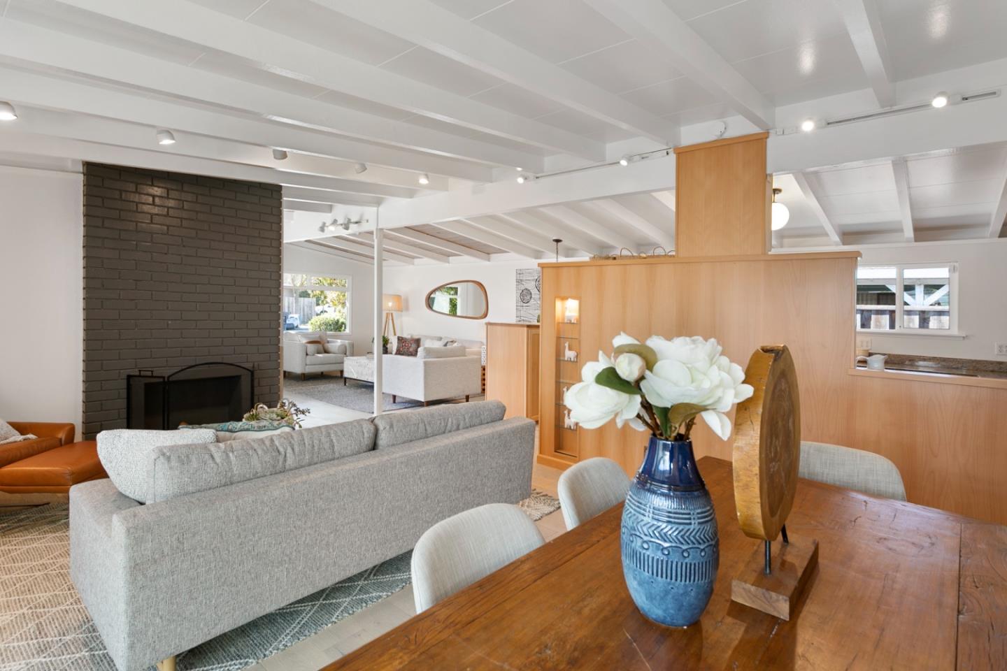 2436 Laura Lane Mountain View, CA 94043 - Photo 8 of 19 a living room with furniture potted plant and a fireplace