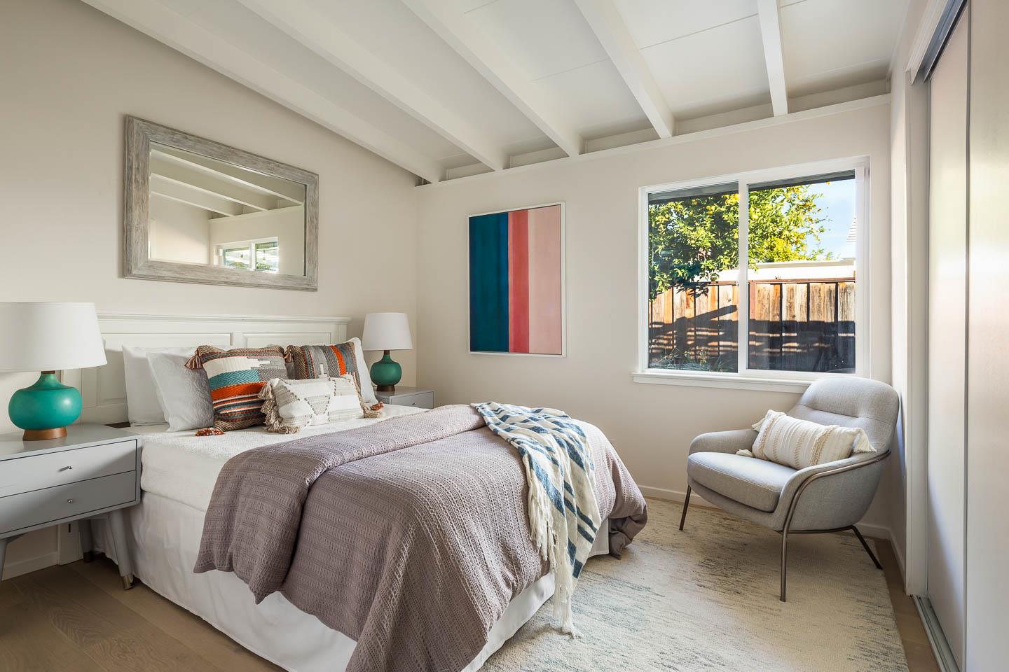 2436 Laura Lane Mountain View, CA 94043 - Photo 9 of 19 a bedroom with a bed and a couch