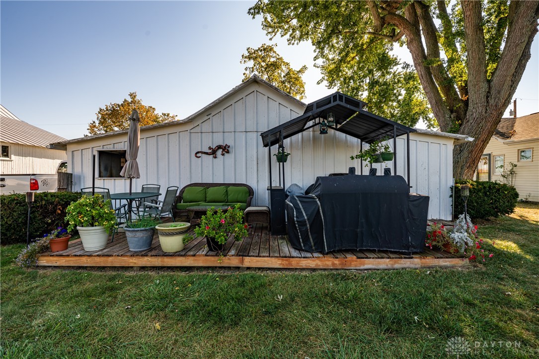 1599 Garringer Road Jamestown, OH 45335 - Photo 50 of 73 This private backyard deck offers an inviting space for relaxation and outdoor entertaining.