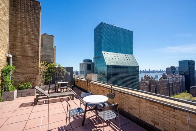 a bathroom with a toilet a sink and a mirror