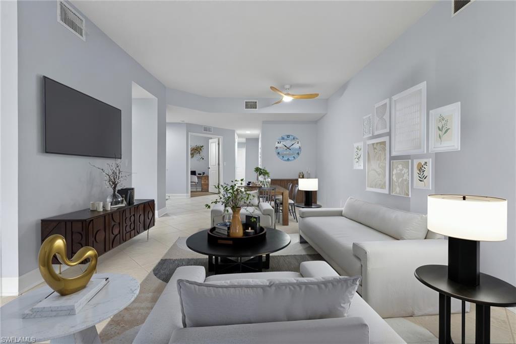 19081 Ridgepoint Drive, Unit 102 Estero, FL 33928 - Photo 1 of 50 a living room with furniture and a flat screen tv