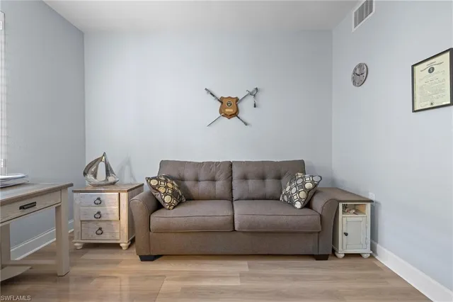 a living room with furniture and a couch