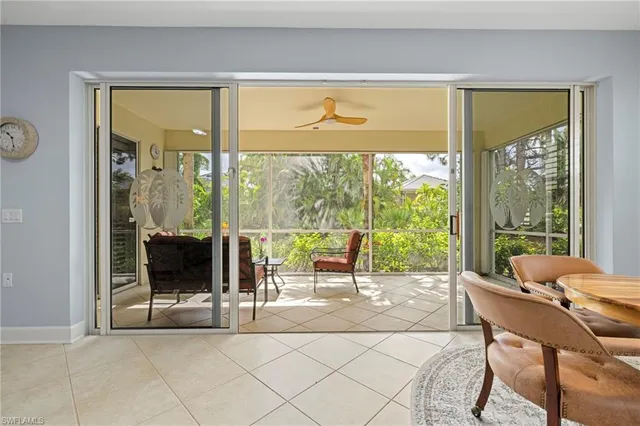 a living room with a large window and a table