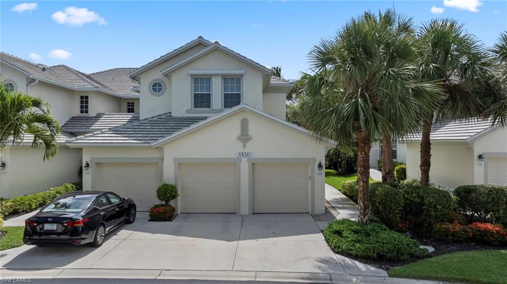 19081 Ridgepoint Drive, Unit 102 Estero, FL 33928 - Photo 23 of 50 a front view of a house with a garden
