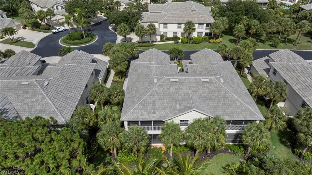 19081 Ridgepoint Drive, Unit 102 Estero, FL 33928 - Photo 26 of 50 an aerial view of a house with garden