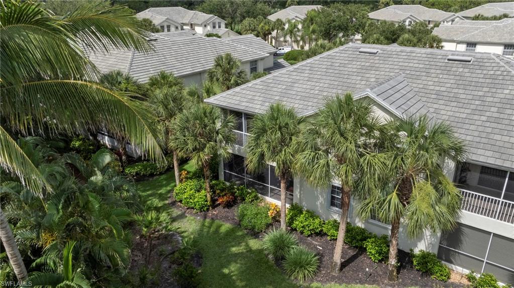 19081 Ridgepoint Drive, Unit 102 Estero, FL 33928 - Photo 27 of 50 a view of a garden with plants