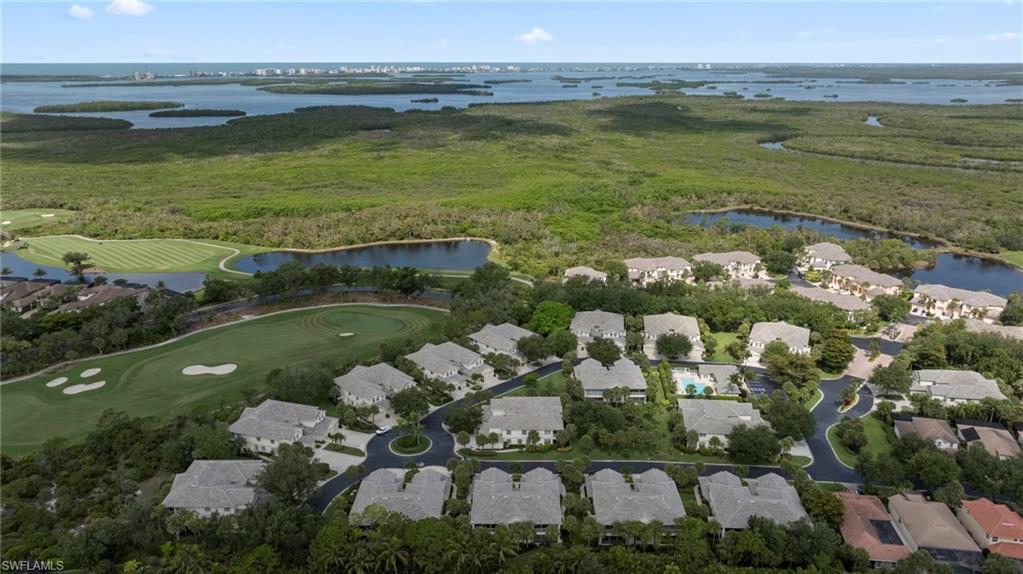 19081 Ridgepoint Drive, Unit 102 Estero, FL 33928 - Photo 28 of 50 a view of a lake with a house