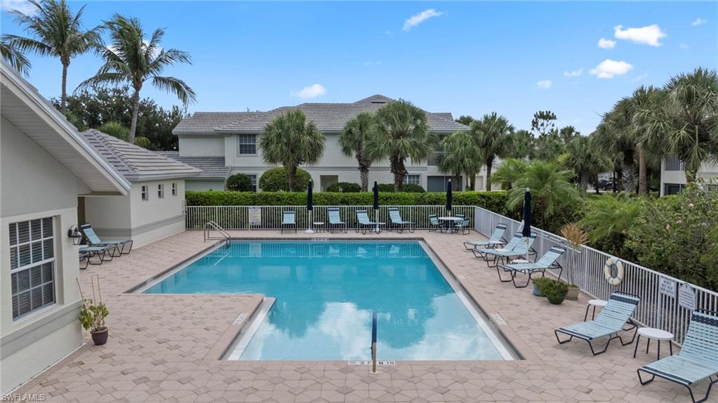 19081 Ridgepoint Drive, Unit 102 Estero, FL 33928 - Photo 30 of 50 swimming pool view with a seating space