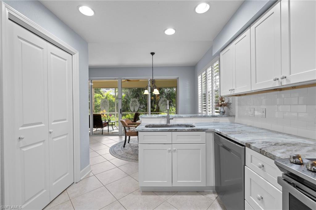 19081 Ridgepoint Drive, Unit 102 Estero, FL 33928 - Photo 4 of 50 a kitchen with a sink and cabinets
