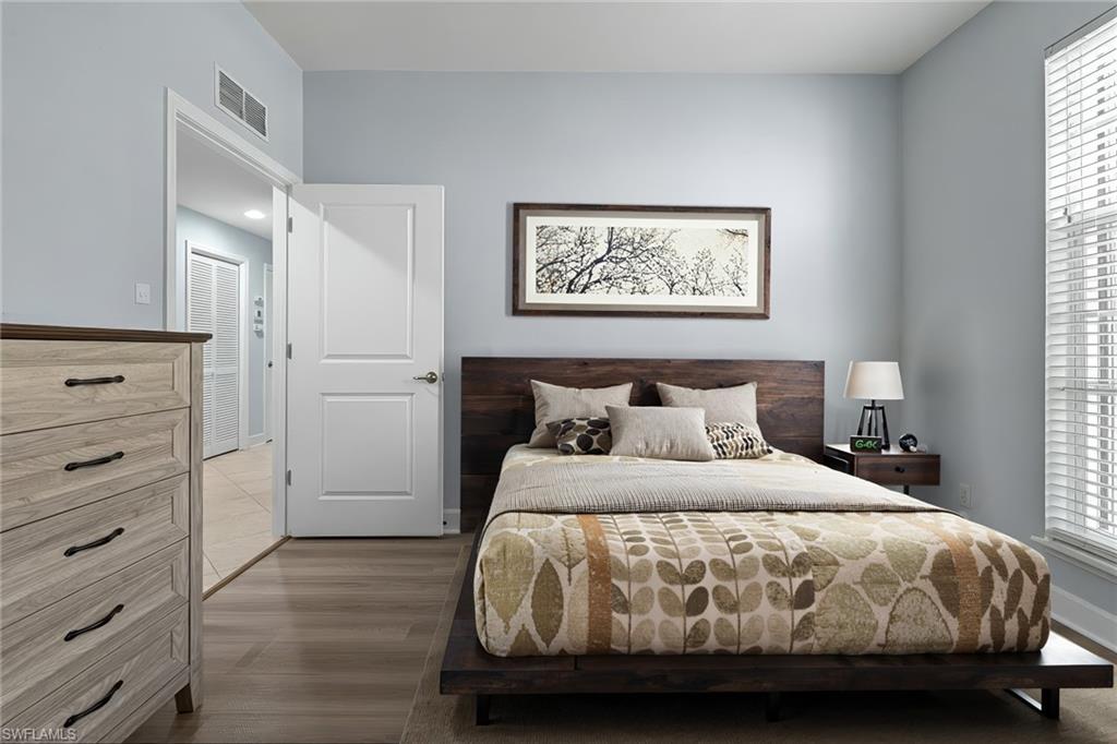 19081 Ridgepoint Drive, Unit 102 Estero, FL 33928 - Photo 7 of 50 a bedroom with a bed and a window