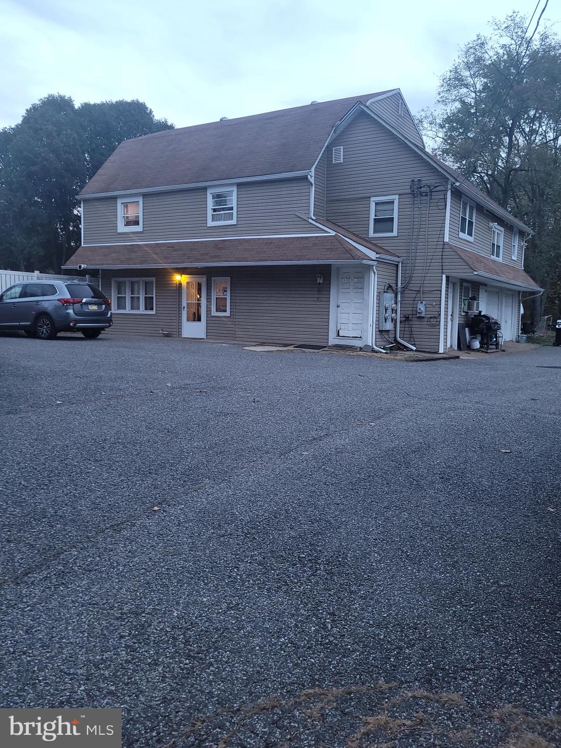 1476 Zebley Road Garnet Valley, PA 19060 - Photo 1 of 15 a front view of a house with parking space and a car parked in front of it