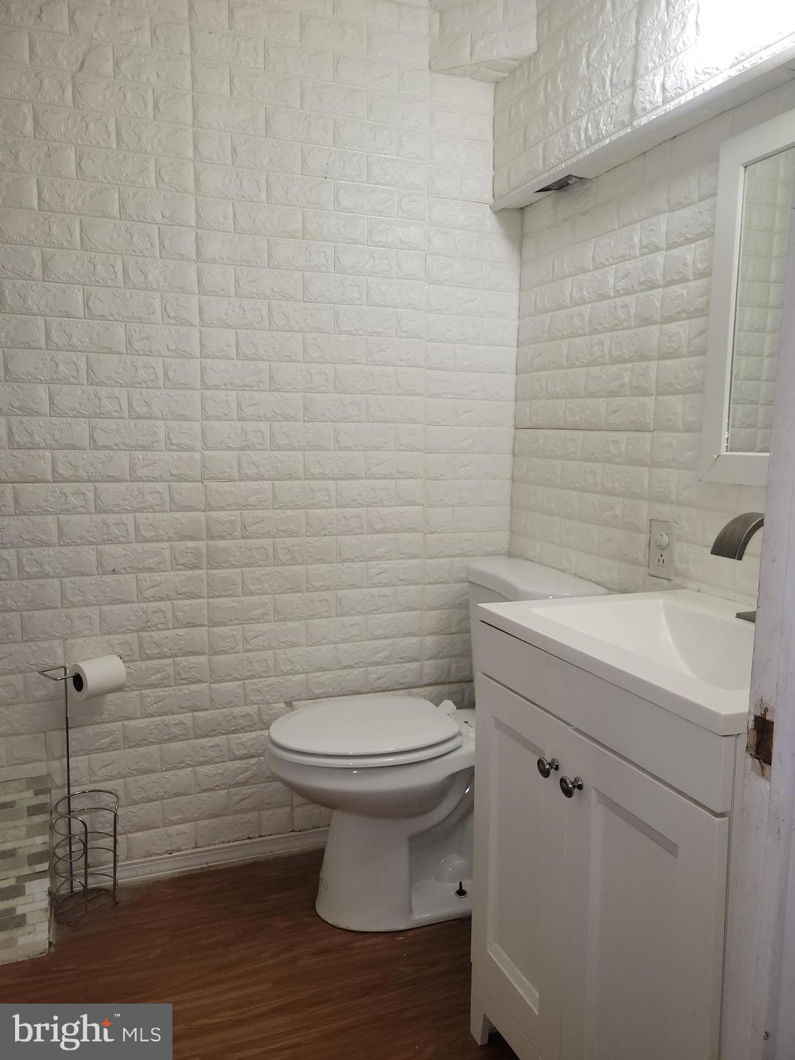 1476 Zebley Road Garnet Valley, PA 19060 - Photo 3 of 15 a bathroom with a toilet a sink and mirror
