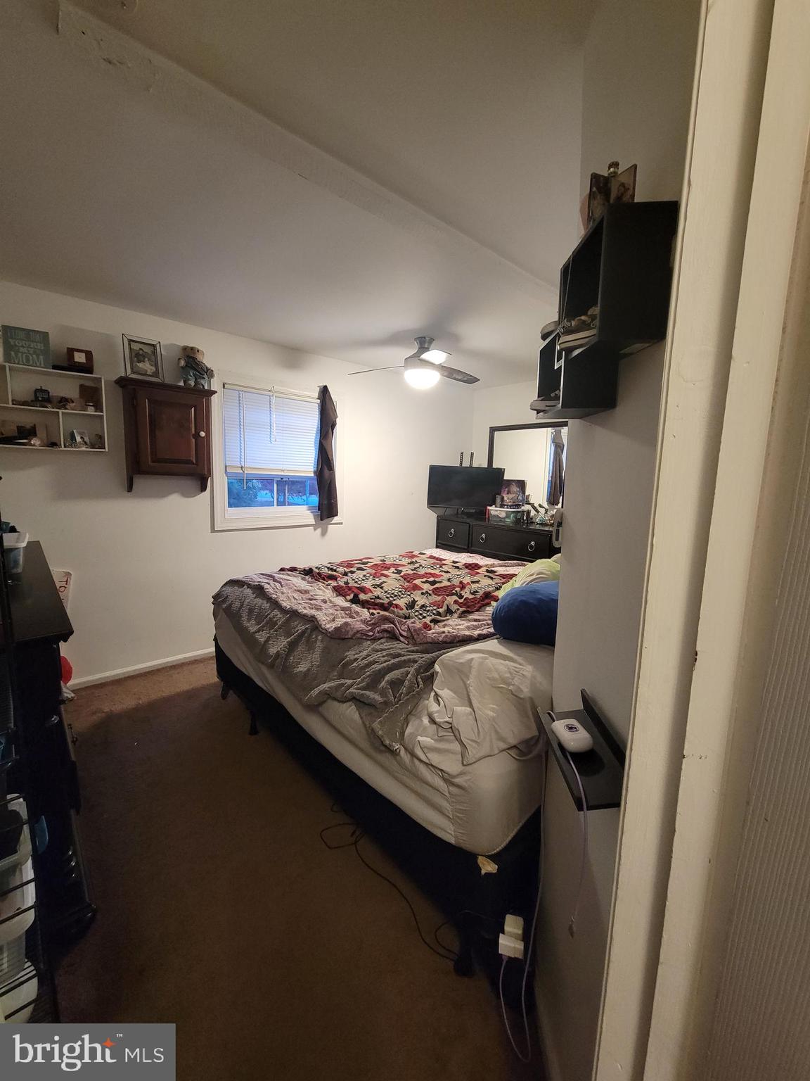1476 Zebley Road Garnet Valley, PA 19060 - Photo 5 of 15 a bedroom with a bed and a tv on the dresser
