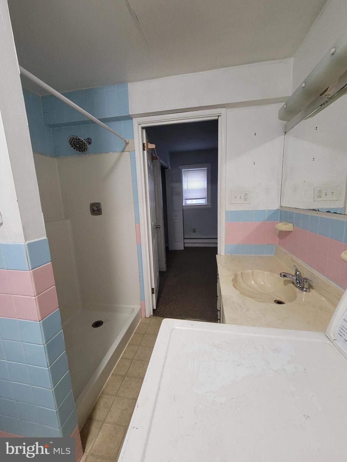 1476 Zebley Road Garnet Valley, PA 19060 - Photo 7 of 15 a bathroom with a sink and a shower